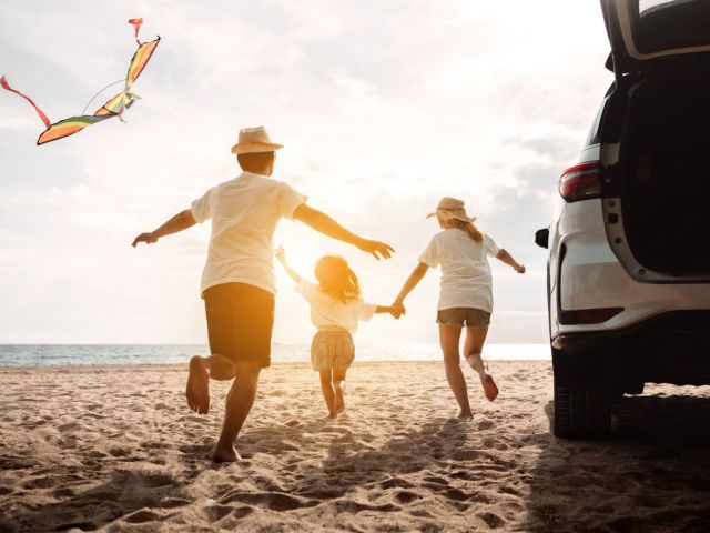 Happy Family with car travel road trip. summer vacation in car in the sunset, Dad, mom and daughter happy traveling enjoy together driving in holidays, people lifestyle ride by automobile.