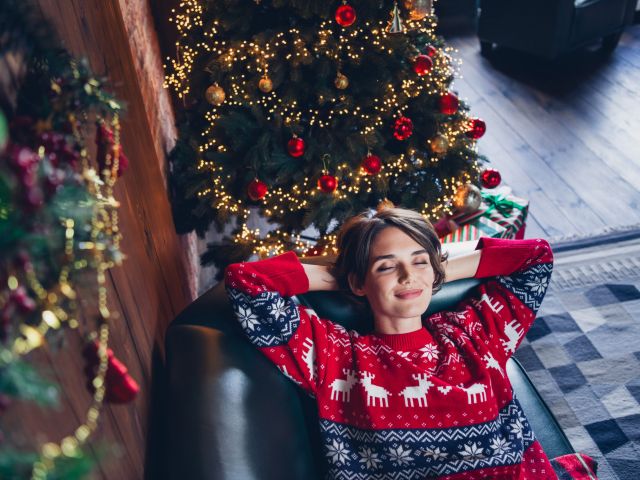Spending at home young girl brown bob hair hands head chilling attractive person pretty dreams enjoying christmas time isolated indoors.