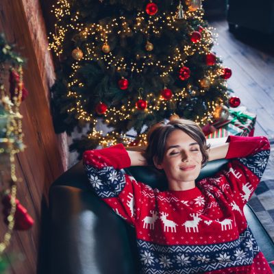 Spending at home young girl brown bob hair hands head chilling attractive person pretty dreams enjoying christmas time isolated indoors